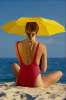 Yellow 674098.JPG Blonde on the beach with an umbrella
