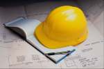 Yellow 674057.JPG Hard hat with notebook and plan